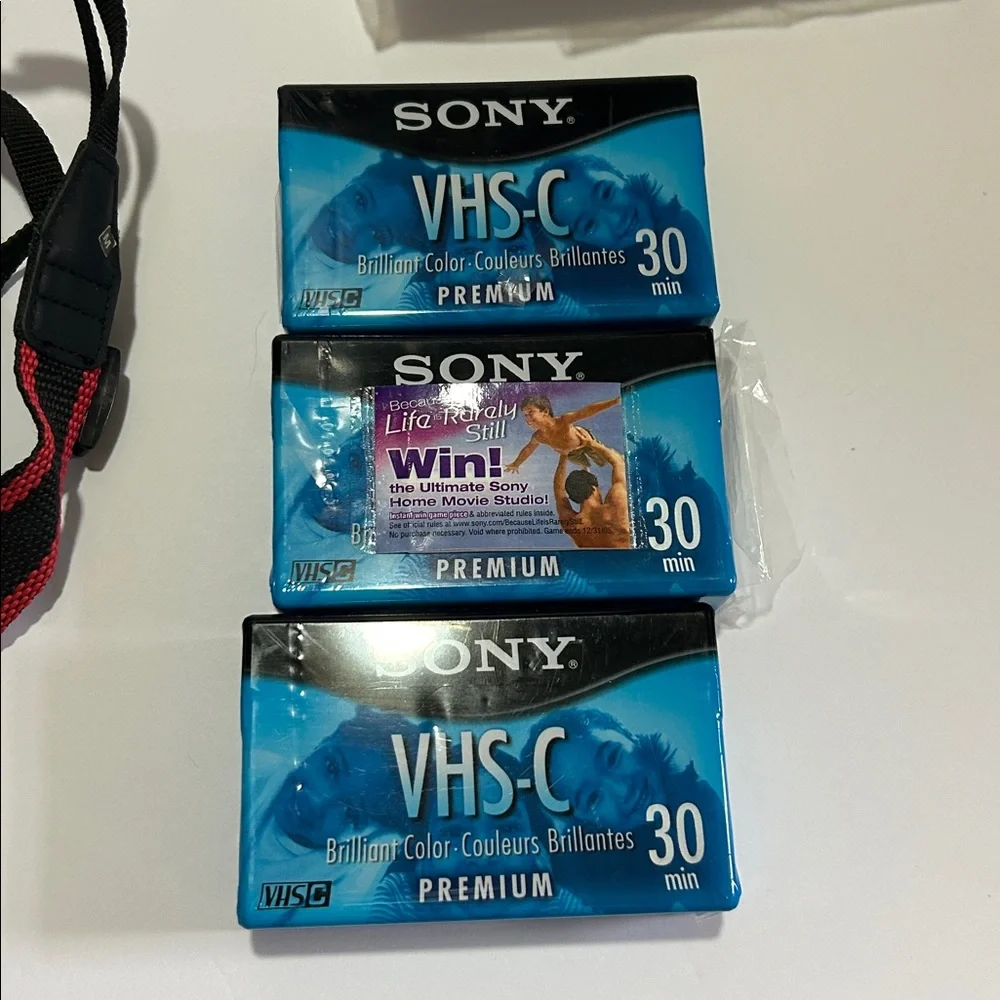 Compact VHS Camcorder in Gray with Red/Black Strap